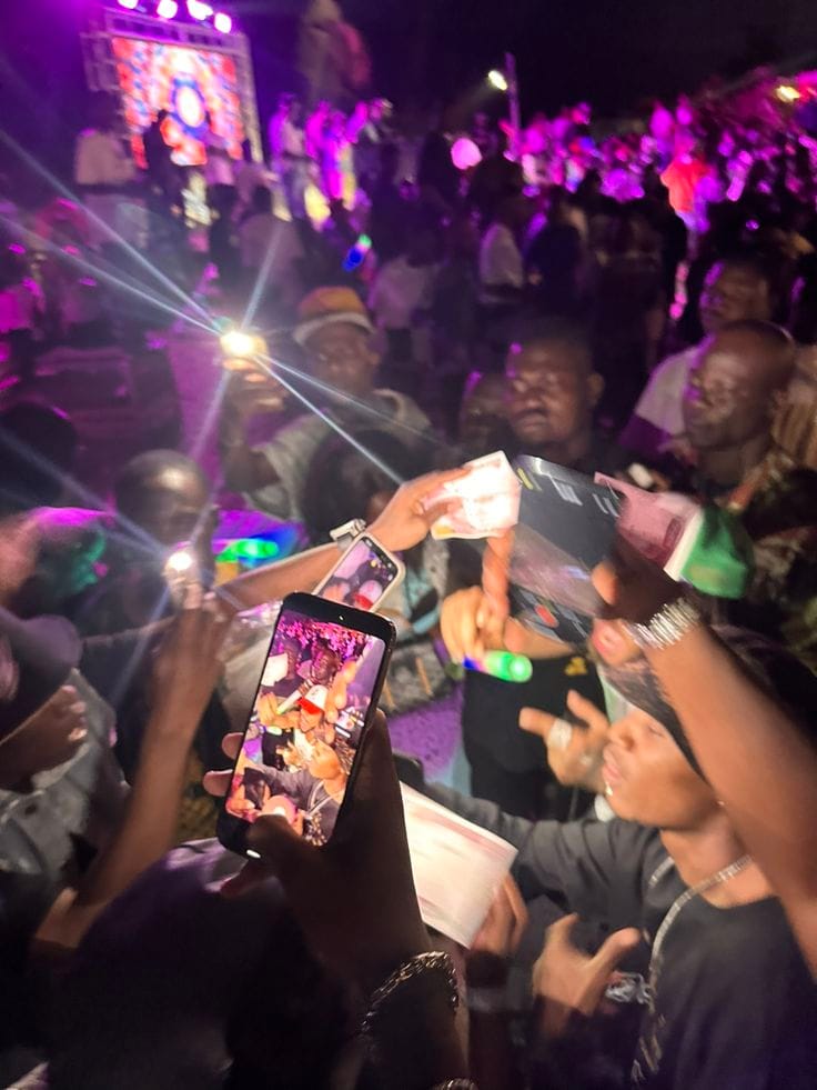 Crowd with phones raised at a live event