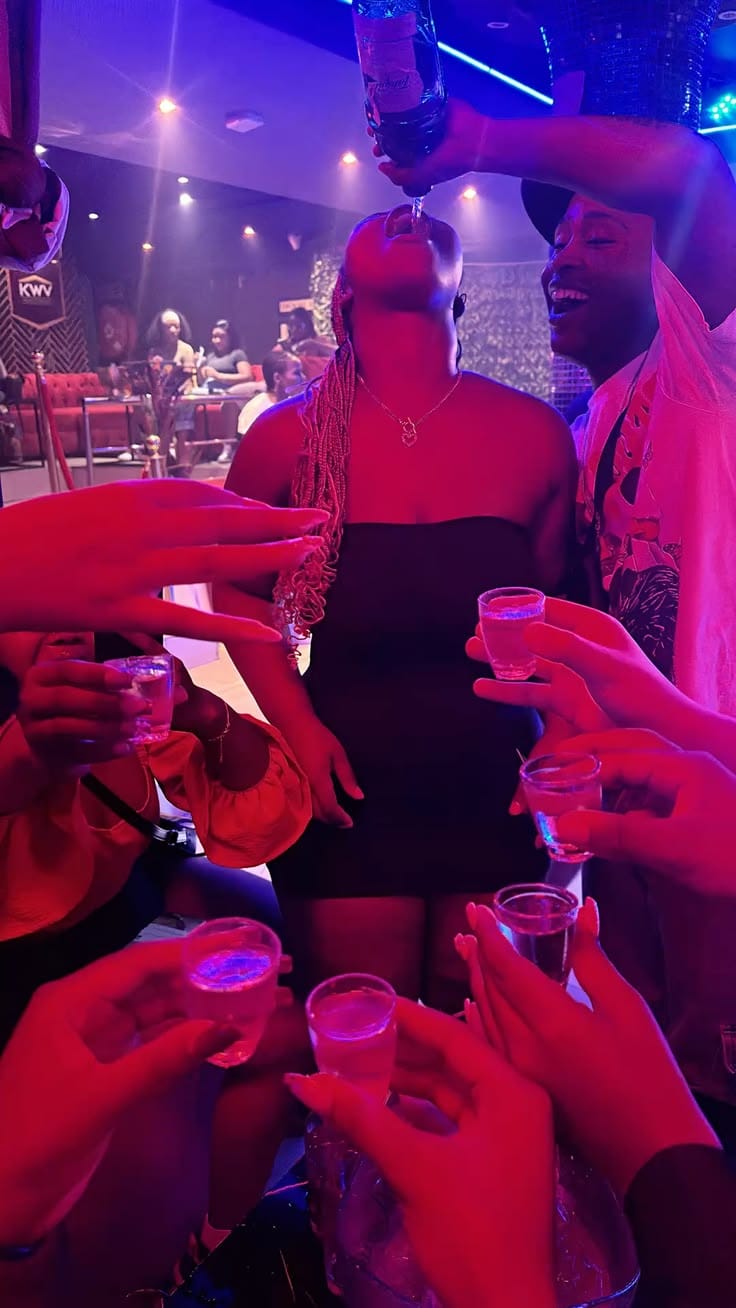 Group celebrating with a round of shots